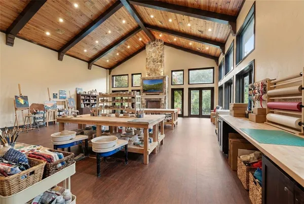 a view of a patio with a table and chairs