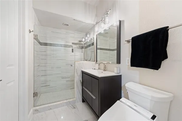 a view of a patio with table and chairs and potted plants