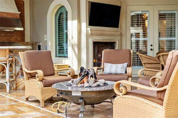a view of house with swimming pool and outdoor seating