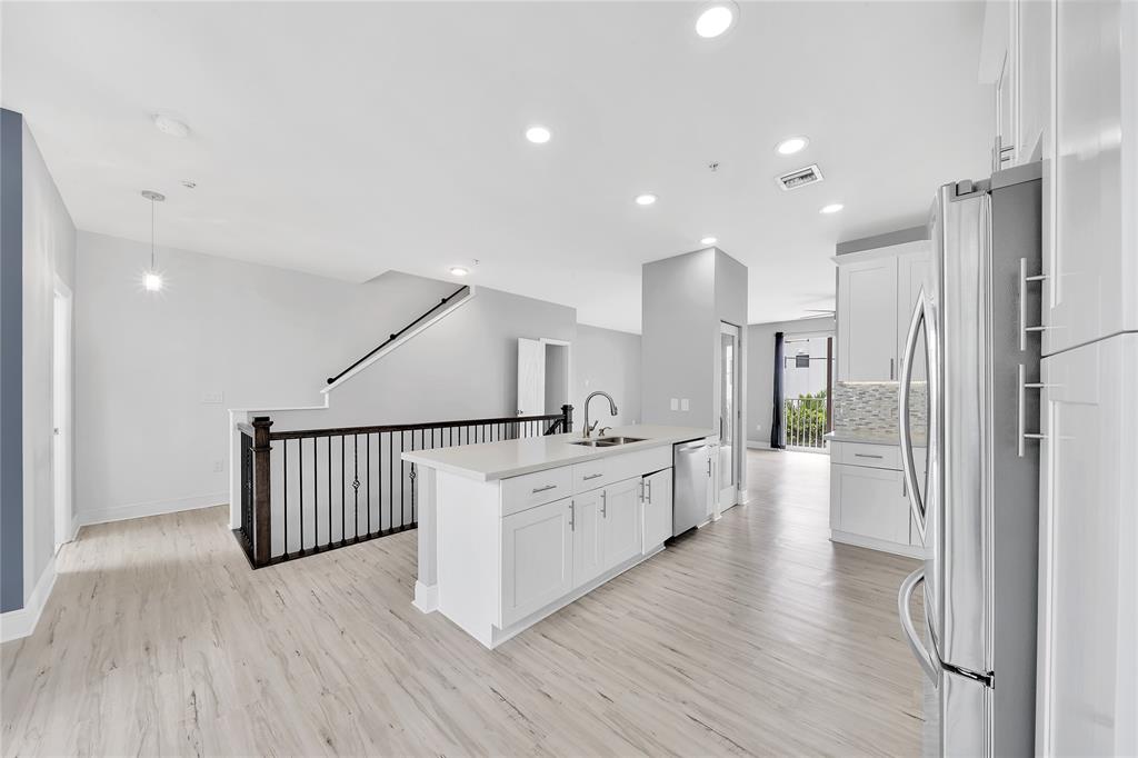 2725 Northeast 8th Avenue, Unit 113 Wilton Manors, FL 33334 - Photo 19 of 72 a large kitchen with a lot of counter space and stainless steel appliances