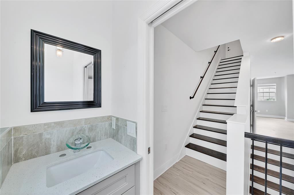 2725 Northeast 8th Avenue, Unit 113 Wilton Manors, FL 33334 - Photo 31 of 72 a bathroom with a sink and a mirror