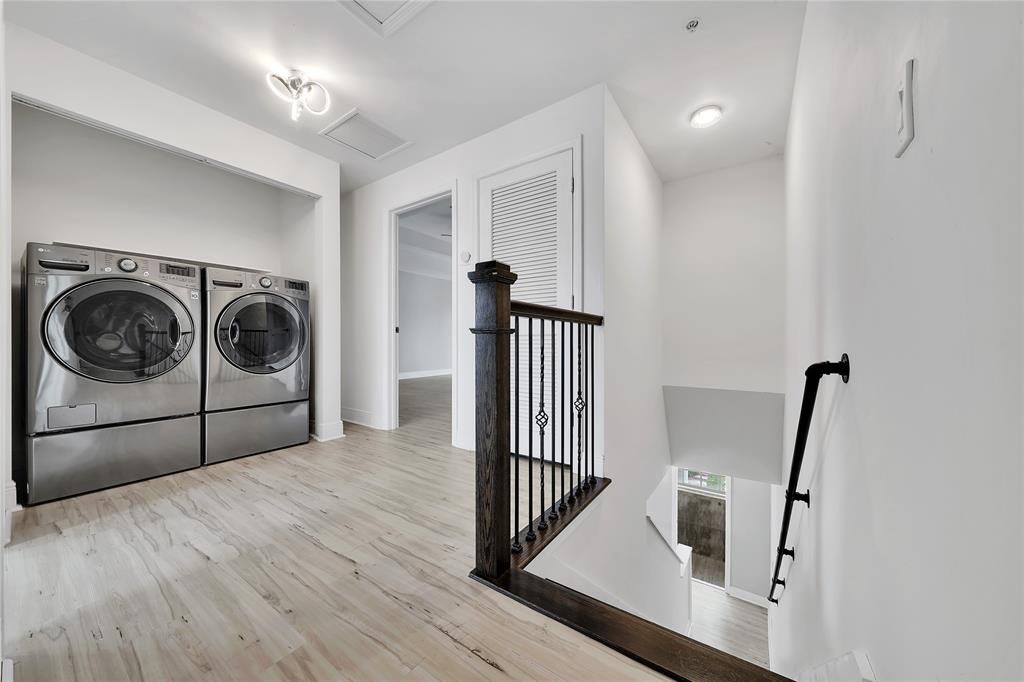 2725 Northeast 8th Avenue, Unit 113 Wilton Manors, FL 33334 - Photo 36 of 72 a view of a hallway with washer and dryer
