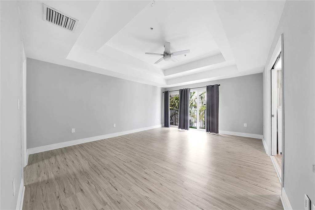 2725 Northeast 8th Avenue, Unit 113 Wilton Manors, FL 33334 - Photo 38 of 72 wooden floor in an empty room with a window