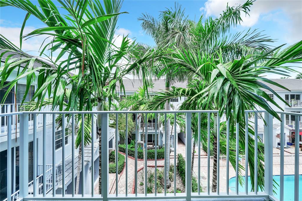 2725 Northeast 8th Avenue, Unit 113 Wilton Manors, FL 33334 - Photo 47 of 72 a view of a balcony with plants