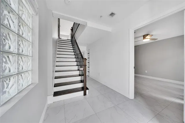 a view of an empty room with a fireplace