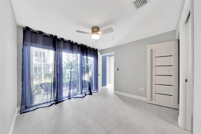 a view of a hallway with wooden floor and stairs