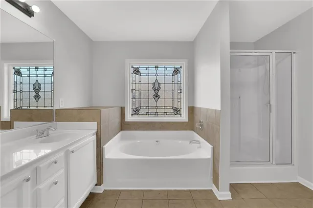 a kitchen with granite countertop a stove a sink and wooden floor