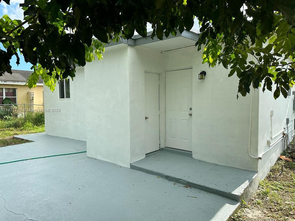 429 Southwest 7th Avenue Homestead, FL 33030 - Photo 13 of 16 an entryway of a house with tree s