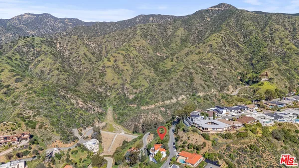 an aerial view of mountain with trees