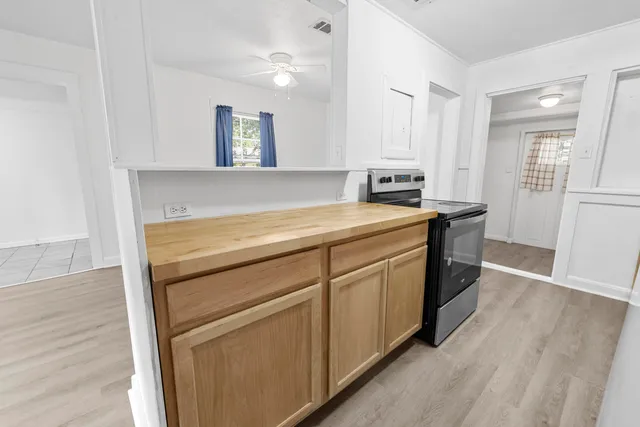 a utility room with cabinets washer and dryer