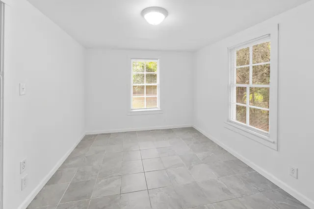 an empty room with windows