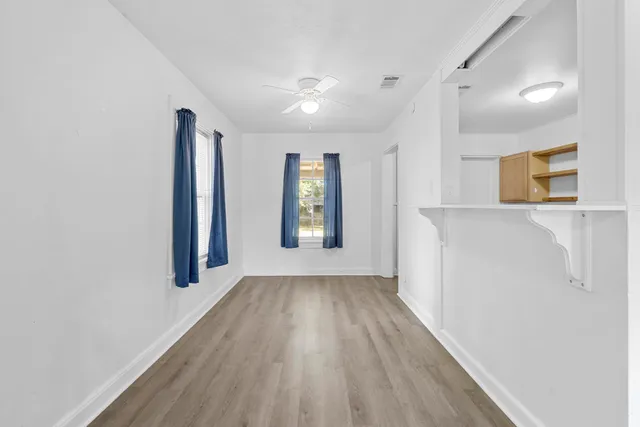 a view of entryway with wooden floor