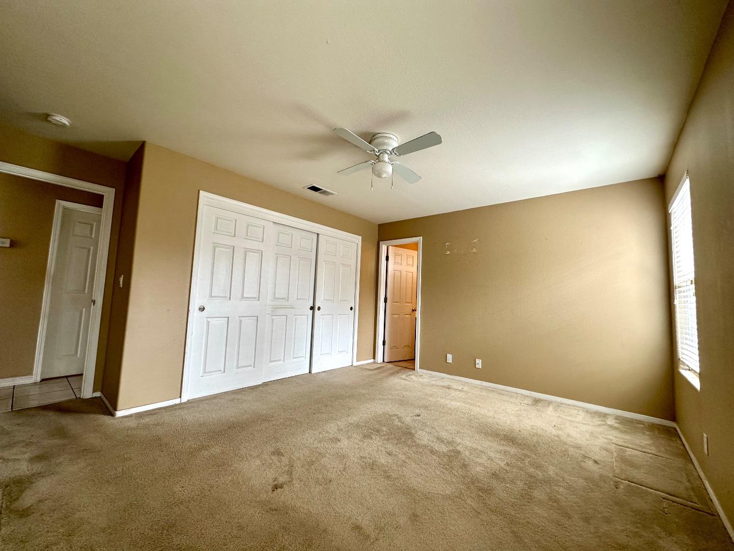 1060 Viewpointe Street Soledad, CA 93960 - Photo 6 of 11 an empty room with closet and windows