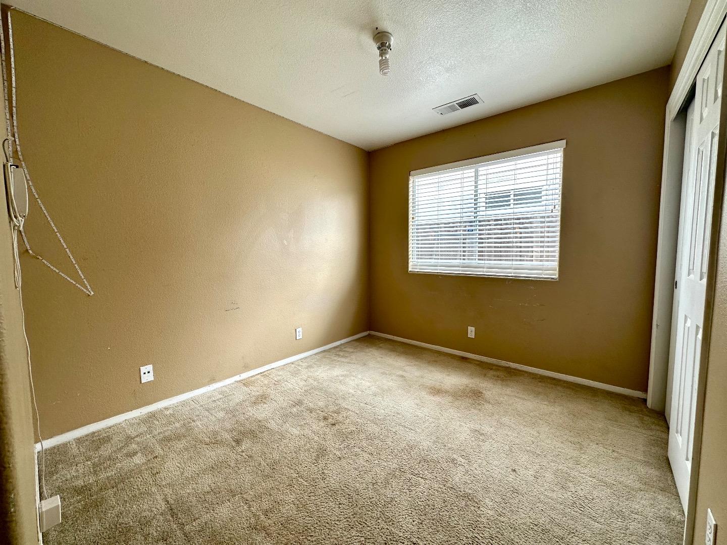 1060 Viewpointe Street Soledad, CA 93960 - Photo 8 of 11 a view of an empty room with a window