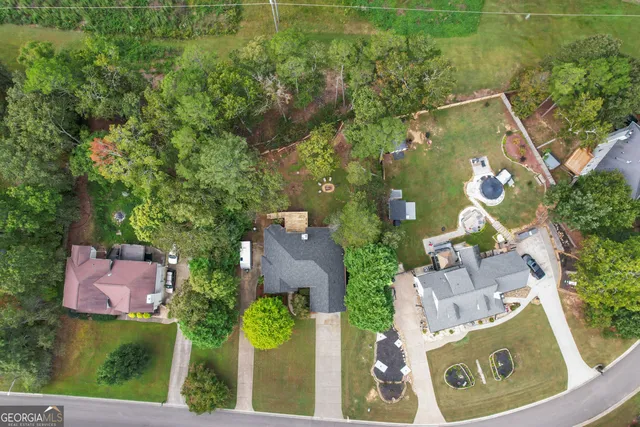 an aerial view of a house with outdoor space and street view