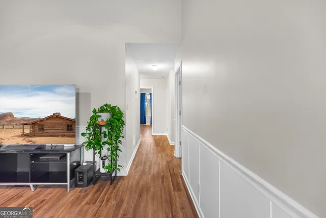 a view of a hallway with potted plants
