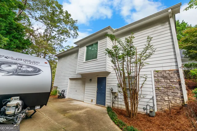 a front view of a house with garage