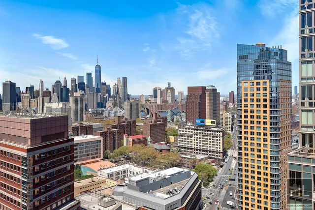 a view of a city with tall buildings