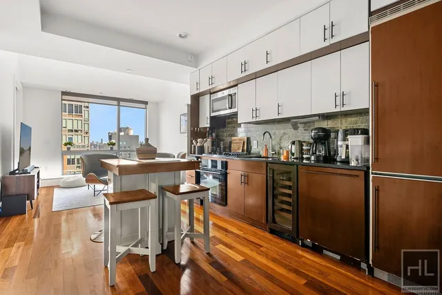a kitchen with stainless steel appliances granite countertop a stove and a sink
