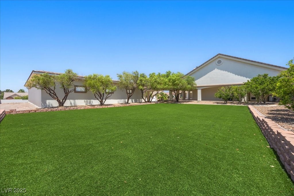 640 Quail Covey Road Henderson, NV 89002 - Photo 50 of 75 Side View of grassy yard on West End of House enough room for a Pickle Ball Court or ?