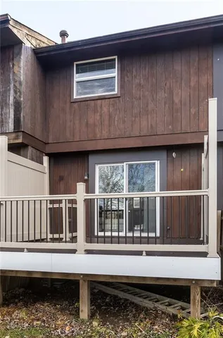 a view of a house with a window and wooden floor