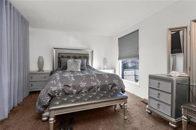 a bedroom with a bed and a closet