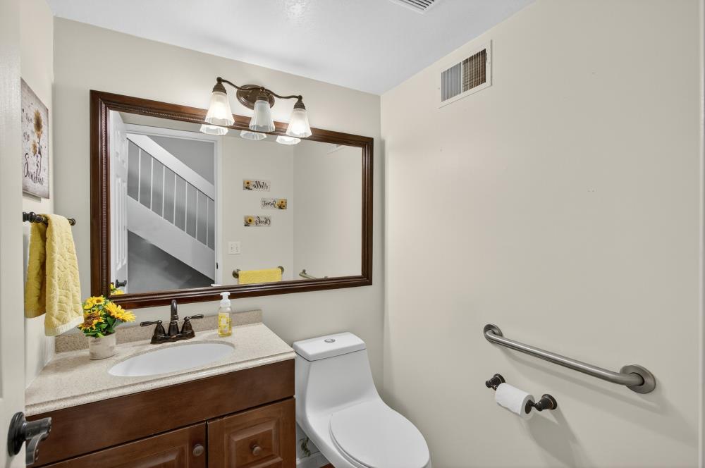 750 Lincoln Road, Unit 62 Yuba City, CA 95991 - Photo 16 of 56 a bathroom with a sink vanity mirror and toilet