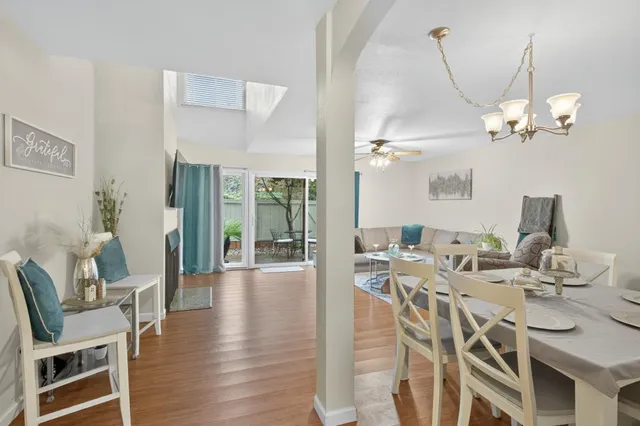 a living room with a fireplace and a flat screen tv