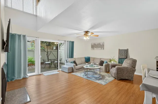 a living room with furniture or couch and a potted plant