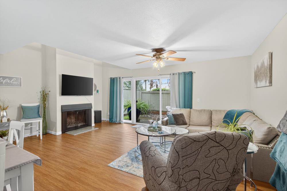 750 Lincoln Road, Unit 62 Yuba City, CA 95991 - Photo 21 of 56 a living room with fireplace furniture and a flat screen tv