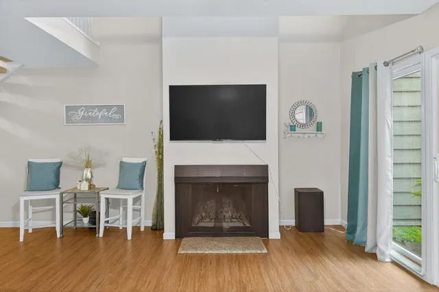 a view of a dining room with furniture wooden floor and a chandelier