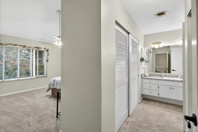 a bathroom with double vanity sinks a mirror and a shower