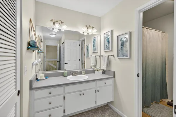 a bathroom with a sink and a mirror