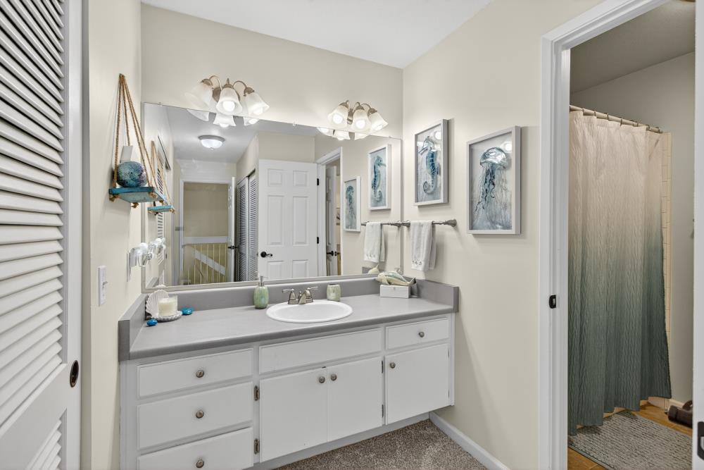 750 Lincoln Road, Unit 62 Yuba City, CA 95991 - Photo 36 of 56 a bathroom with double vanity sinks a vanity two mirror and a shower