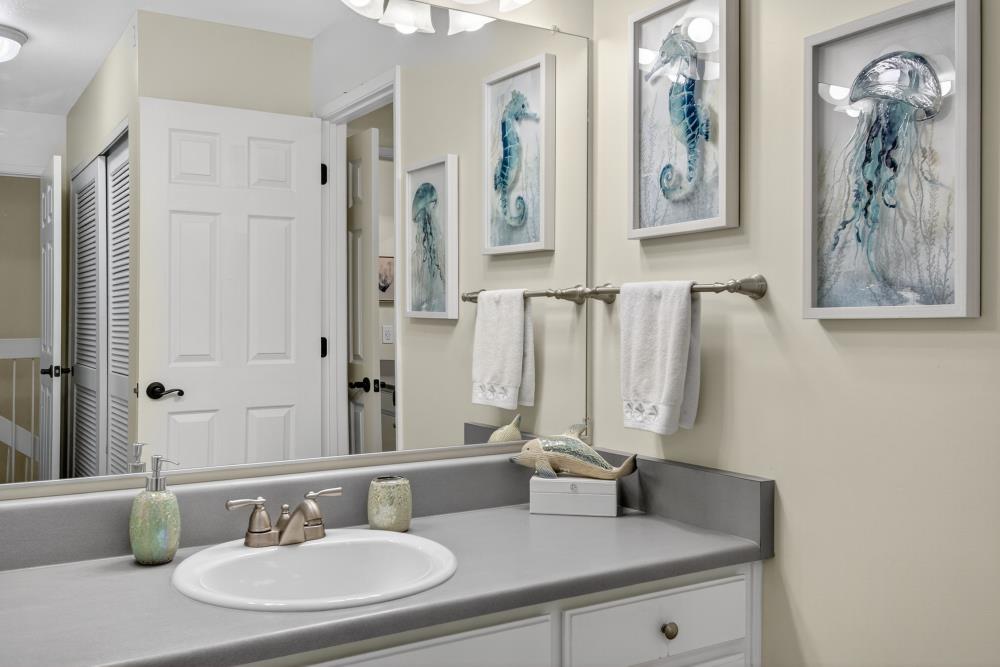 750 Lincoln Road, Unit 62 Yuba City, CA 95991 - Photo 37 of 56 a bathroom with double vanity sinks a mirror and a shower