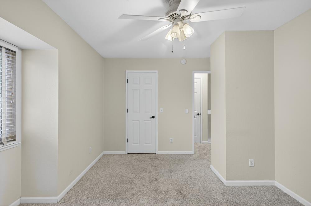 750 Lincoln Road, Unit 62 Yuba City, CA 95991 - Photo 44 of 56 an empty room with chandelier fan