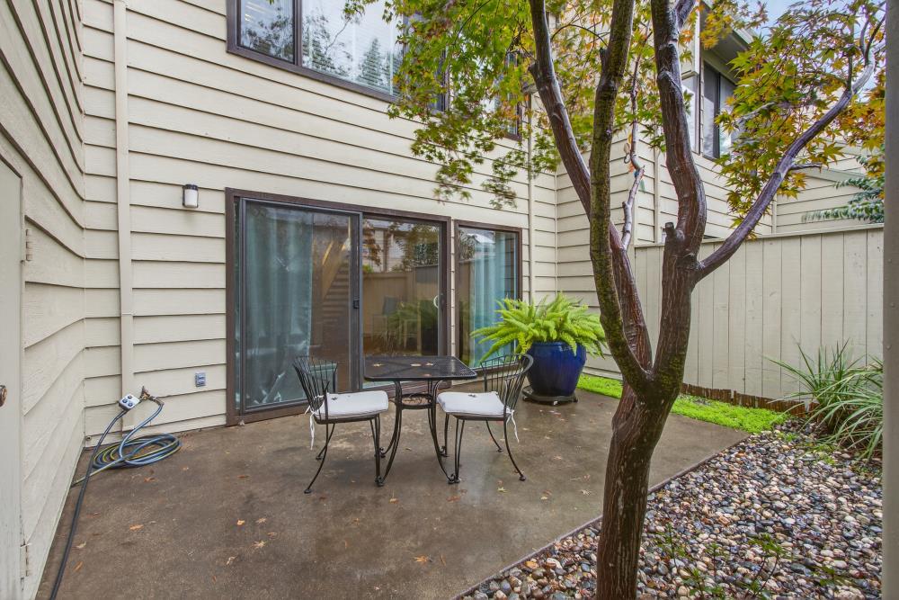 750 Lincoln Road, Unit 62 Yuba City, CA 95991 - Photo 50 of 56 a view of a patio with table and chairs and potted plants