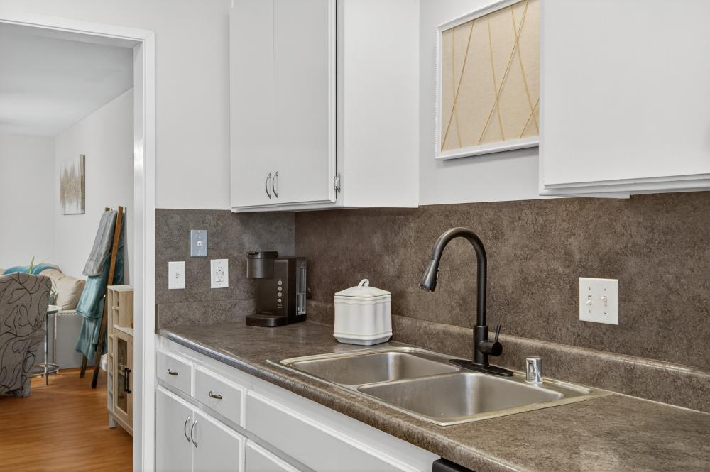 750 Lincoln Road, Unit 62 Yuba City, CA 95991 - Photo 10 of 56 a kitchen with granite countertop a sink a stove and cabinets