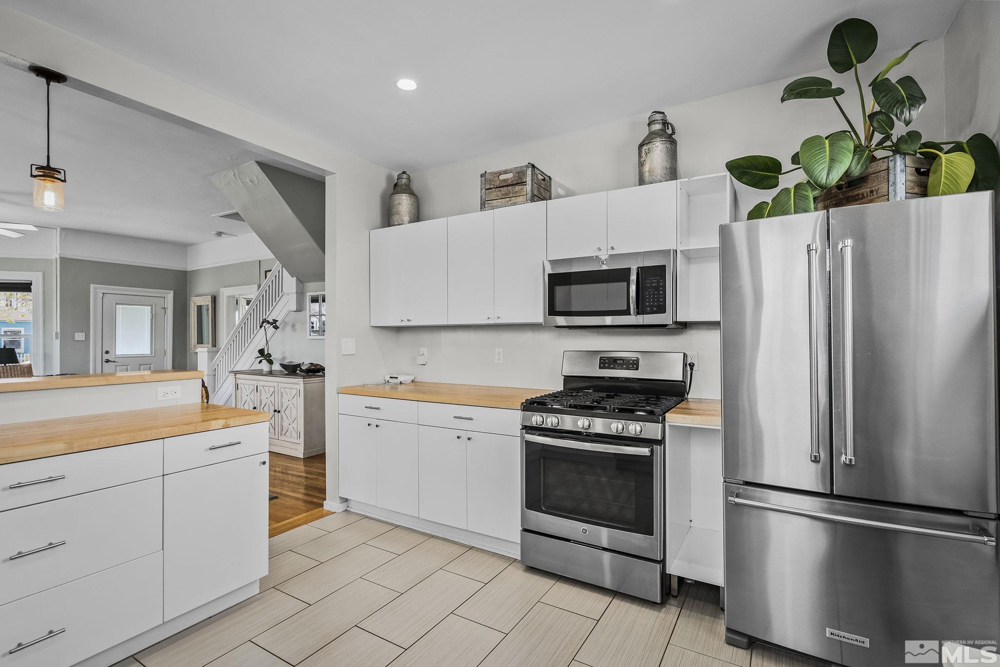 546 Sinclair Street Reno, NV 89501 - Photo 11 of 27 a kitchen with a refrigerator sink and stove