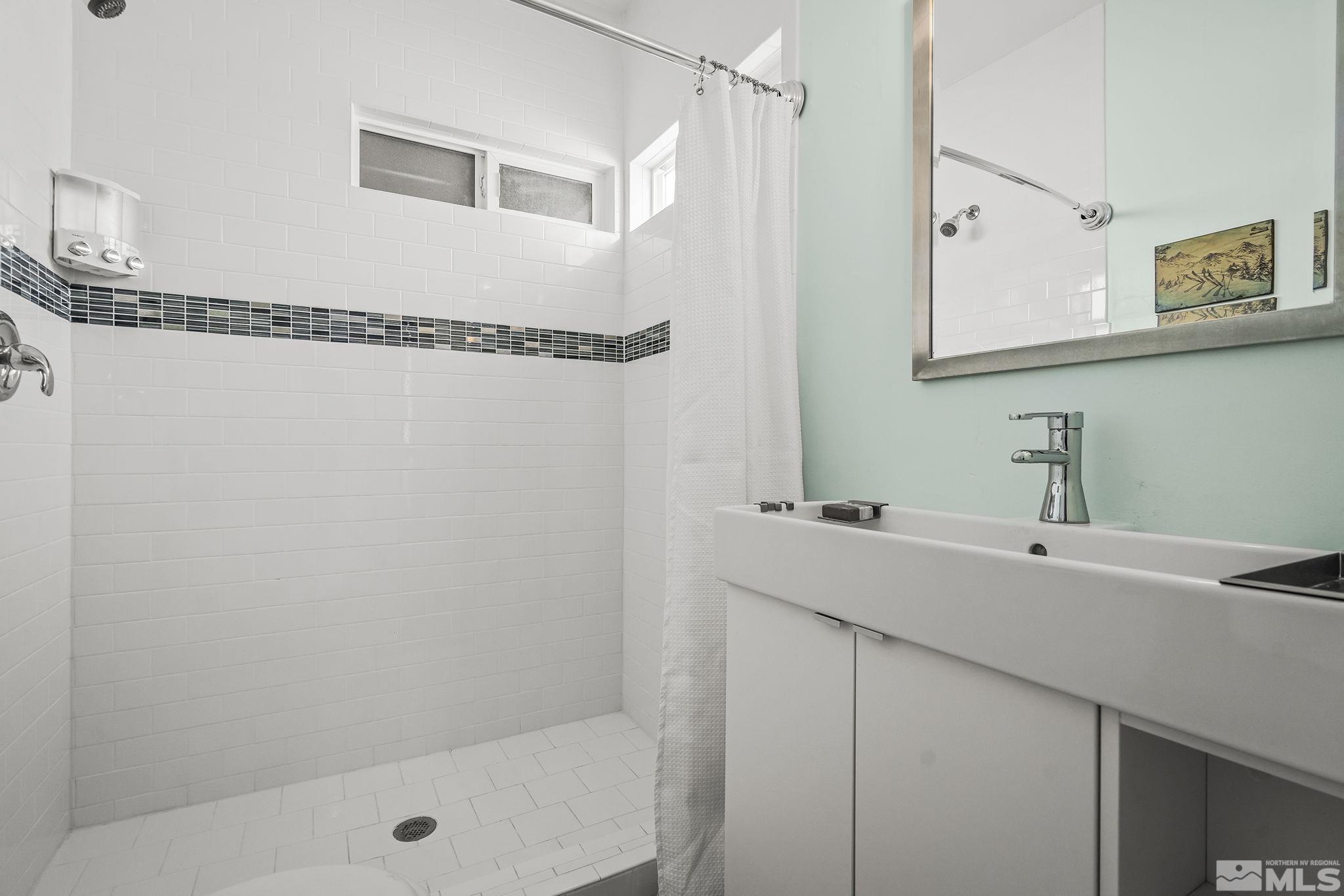 546 Sinclair Street Reno, NV 89501 - Photo 19 of 27 a bathroom with a sink and a mirror