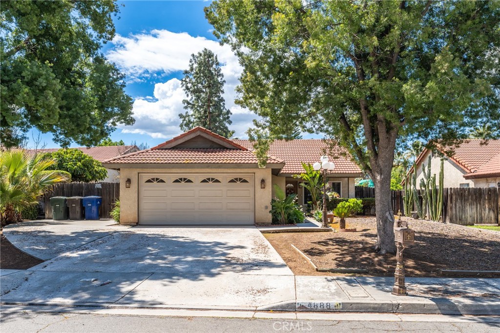 4888 Newport Lane Riverside, CA 92504 - Photo 1 of 1 a front view of a house with a garden