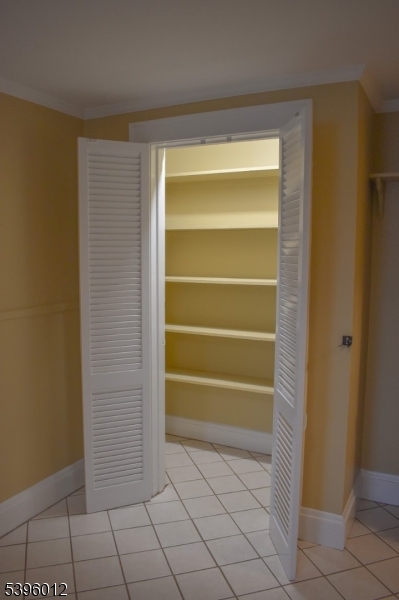 13 West Main Street Mendham, NJ 07945 - Photo 13 of 17 a view of an empty room with empty shelves