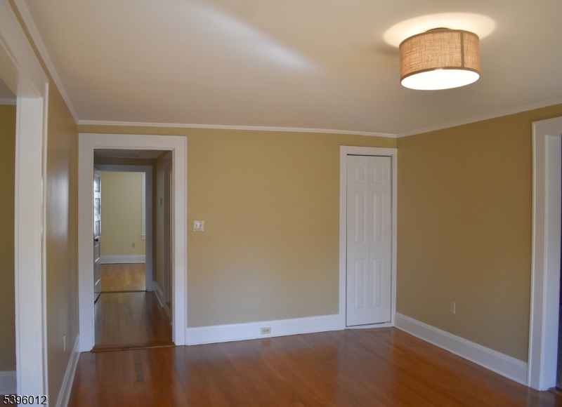 13 West Main Street Mendham, NJ 07945 - Photo 4 of 17 an empty room with wooden floor closet and windows