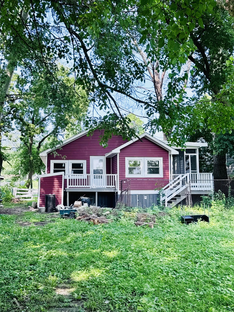 27849 West Lakeshore Drive Spring Grove, IL 60081 - Photo 4 of 15 a front view of a house with a yard and trees
