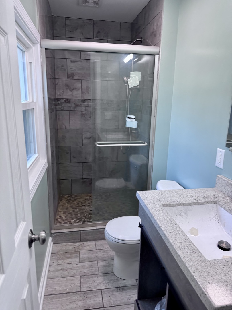 27849 West Lakeshore Drive Spring Grove, IL 60081 - Photo 7 of 15 a bathroom with a sink a toilet and shower