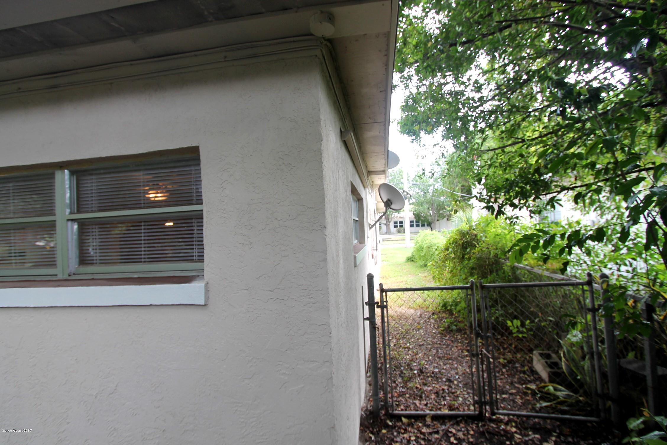 2509 Gulfstream Road, Unit 1 Orlando, FL 32805 - Photo 46 of 48 Right side of home