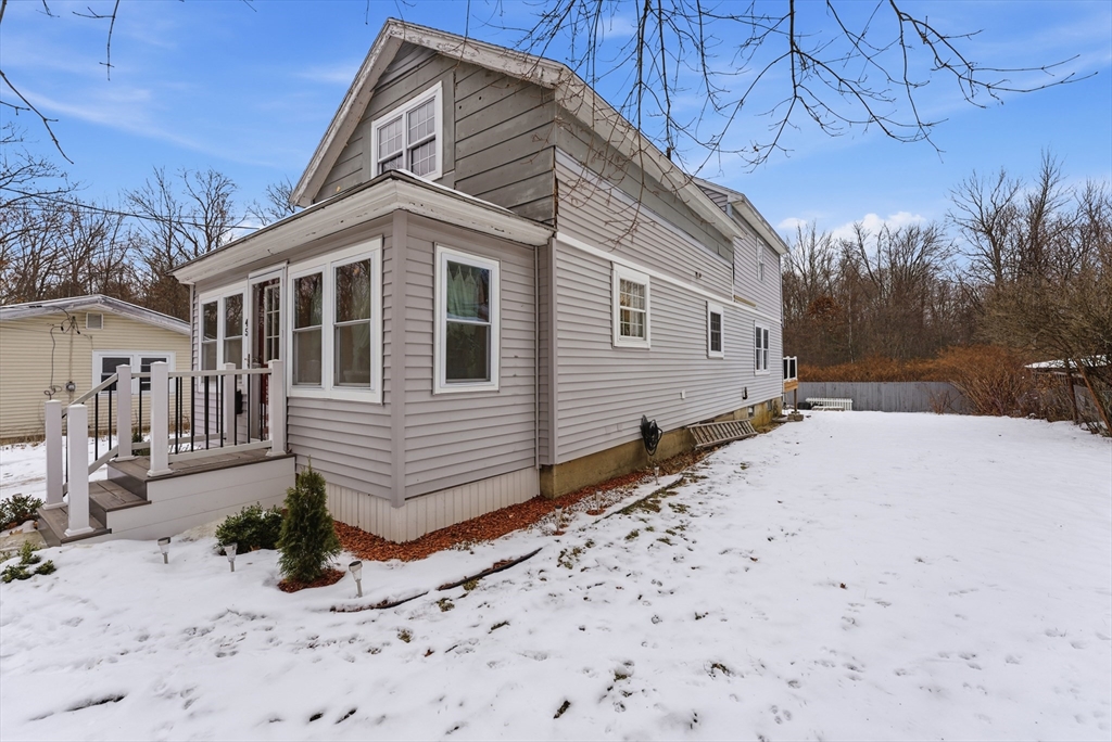 45 Pike Street Athol, MA 01331 - Photo 2 of 38 a front view of a house with a yard covered in snow
