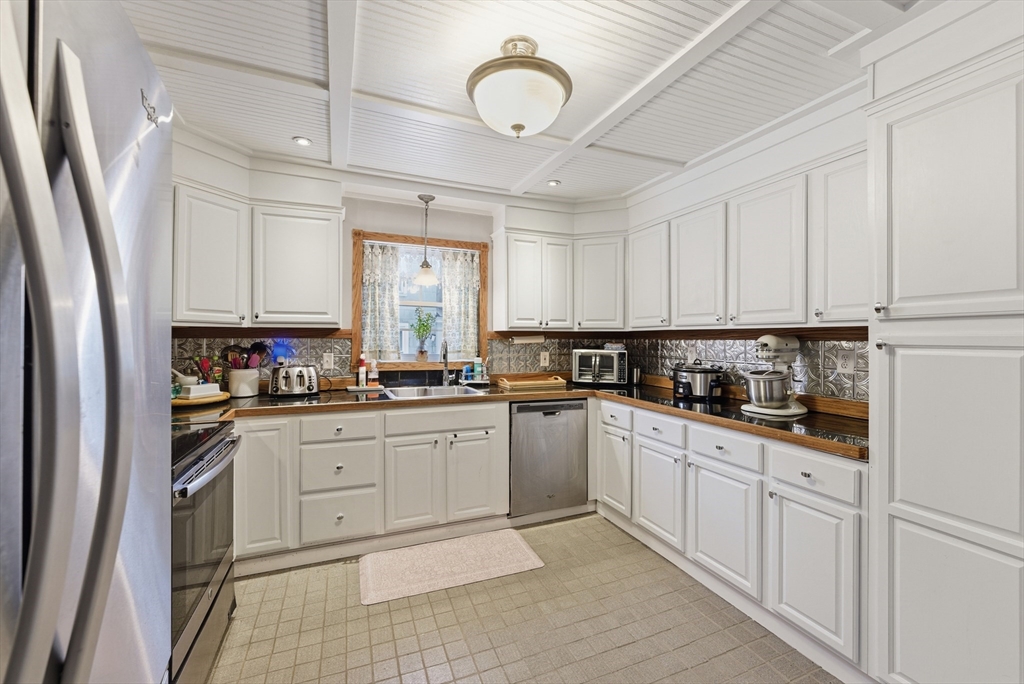 45 Pike Street Athol, MA 01331 - Photo 6 of 38 a kitchen with white cabinets and white appliances