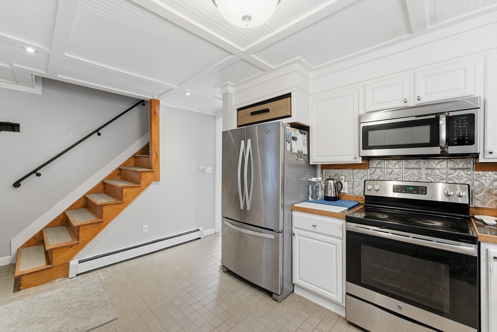 45 Pike Street Athol, MA 01331 - Photo 8 of 38 a kitchen with stainless steel appliances and white cabinets