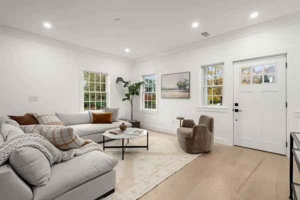 a living room with furniture and windows